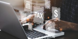 Busines using a computer to complete Individual income tax return form online for tax payment. Government, state taxes. Data analysis, paperwork, financial research, report. Calculation tax return.